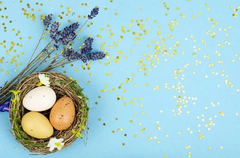 Decorated handmade Easter eggs for the holiday season on blue background. Cre 写真素材