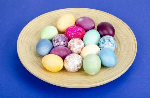 Decorated handmade Easter eggs for the holiday season on blue background. Cre Stock Photos