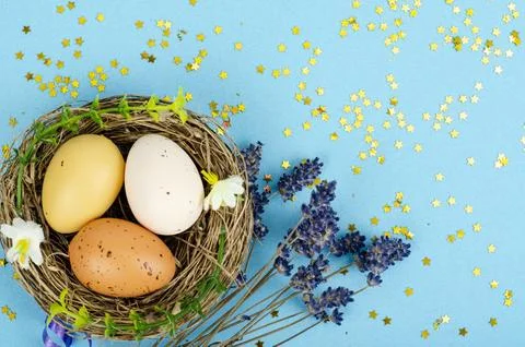 Decorated handmade Easter eggs for the holiday season on blue background. C.. Stock Photos