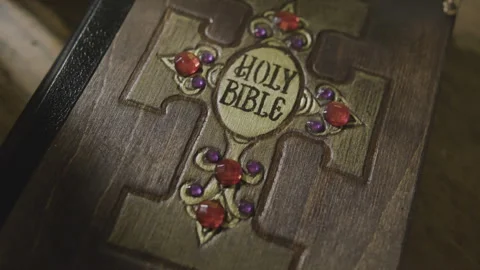 Decorated Holy Bible camera moving in  Stock Footage 257611739