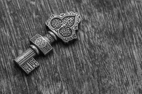 Decorated key  over a rustic background -  black and withe Stock Photos