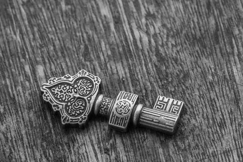 Decorated key  over a rustic background - center - black and withe 写真素材