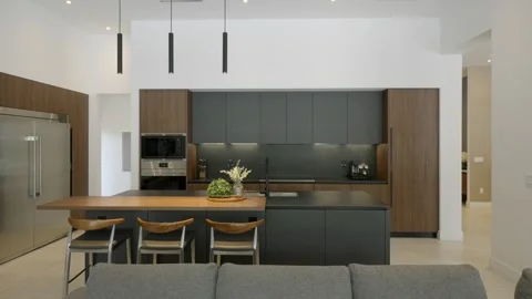 Decorated kitchen interior with minimalist design. Cabinets with integrated Stock Footage 294906983