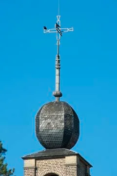 Decorated monastery tower with cross Stock Photos