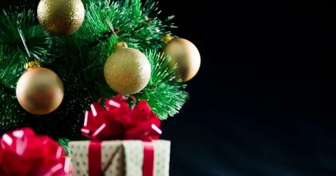 Decorated New year Christmas tree baubles gifts box 4k close-up video copy space Stock Footage 70671322