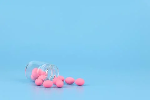 Decorated pink easter eggs in bottle with blue background Foto stock