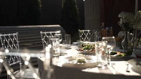 Decorated set table in restaurant with flowers in vase Stock Footage 302309770