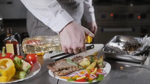 Decorated with a sprig of rosemary. the chef prepares in the restaurant. Grilled Stock Footage 85074783