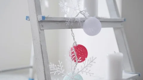 Decorated stepladder in the new year style. Christmas concept. slow motion Stock Footage 98767846