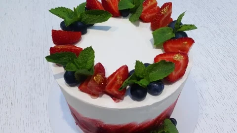 Decorated strawberry cake. Large cake, mousse strawberry pieces, dessert Stock Footage 314898203