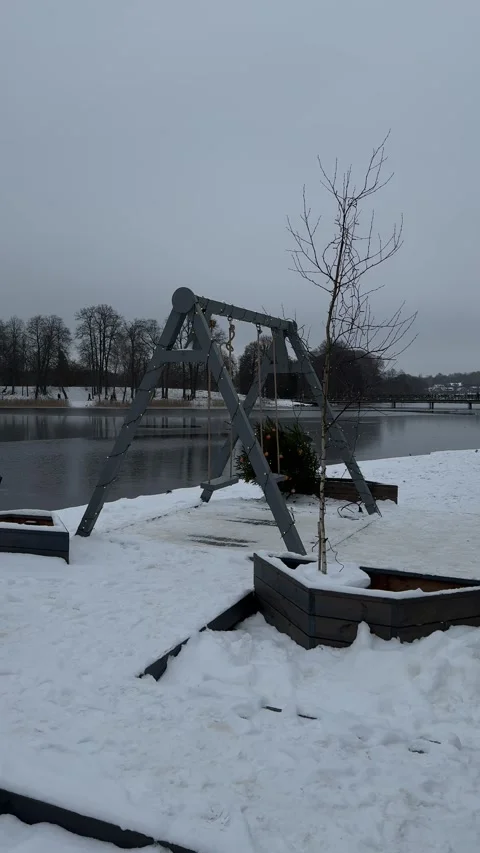 Decorated swing in Trakai town in winter, Lithuania. Vertical video Stock Footage 258783501