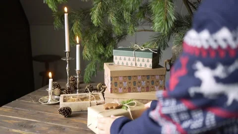 Decorated table with Christmas gift boxes Stock Footage 163758940