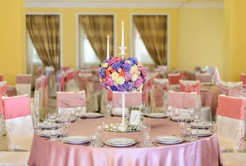 Decorated table with flowers in the elegant restaurant for the perfect wedding Stock Photos