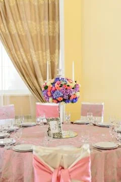 Decorated table with flowers in the elegant restaurant for the perfect wedding Stock Photos
