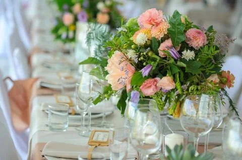 Decorated table, flowers Stock Photos