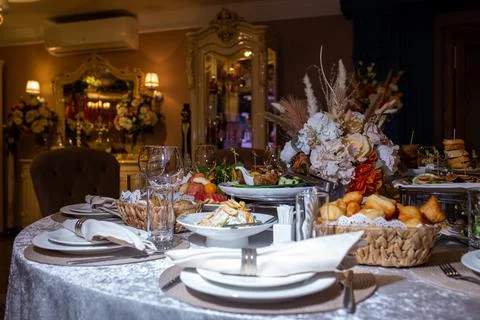 Decorated table in the restaurant for the celebration. table with various dis Stock Photos