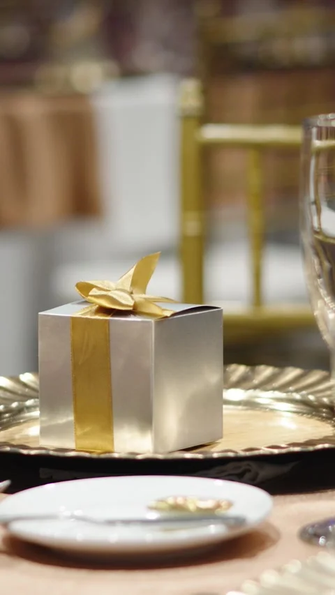 Decorated table for wedding banquet with a gift box for guests Stock Footage 270081914