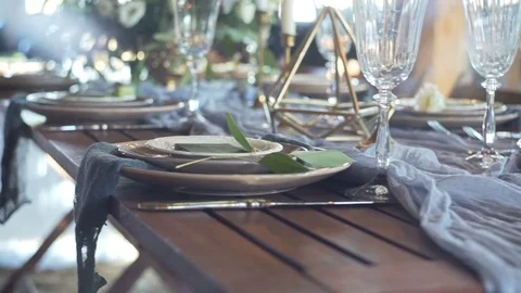 Decorated table for a wedding dinner in wooden Stock Footage