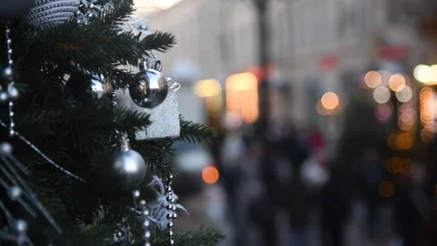 Decorated tree shines during festive holiday celebration in busy market Stock Footage 300085431