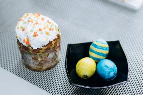Decorated Ukrainian Easter with painted yellow and blue eggs stands on the ta Stock Photos