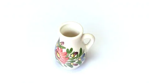 A decorated vase rotates on white Stock Footage 35520915