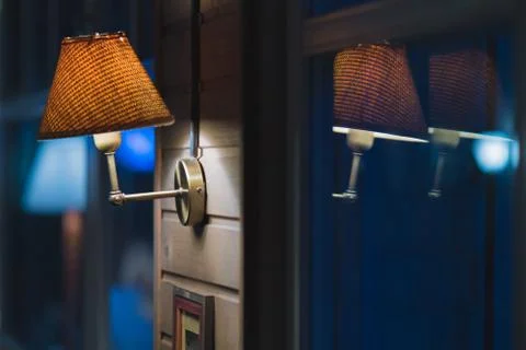 Decorated wall in a cafe, empty frames on the wall, vintage lamps, leather se Stock Photos