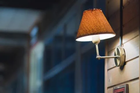 Decorated wall in a cafe, empty frames on the wall, vintage lamps, leather se Stock Photos