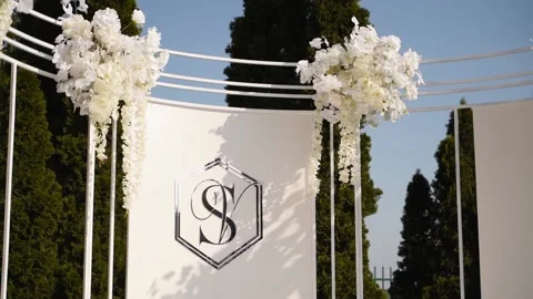 Decorated wedding ceremony arch background with initials of bride anf groom name Video stock 199292793