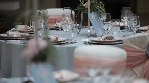 Decorated wedding table with with flowers  and glasses in the restaurant Stock Footage 105001616