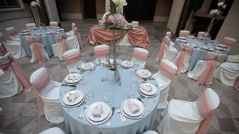 Decorated wedding table with with flowers  and glasses in the restaurant Stock Footage 105001725