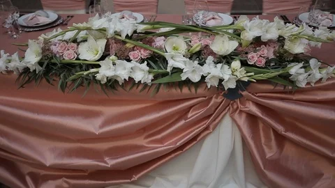Decorated wedding table with with flowers  and glasses in the restaurant Stock Footage 105001834