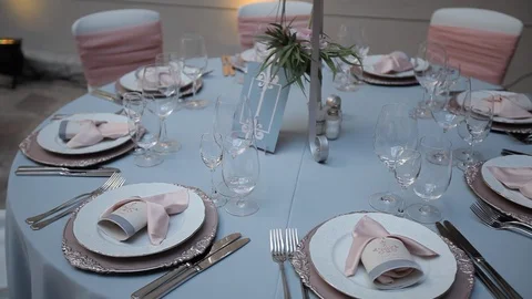 Decorated wedding table with with flowers  and glasses in the restaurant Stock Footage 105001941