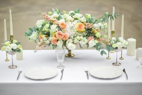 Decorated wedding table for two with beautiful flower composition of flowers Stock Photos