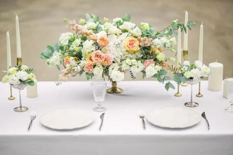Decorated wedding table for two with beautiful flower composition of flowers Fotos Stock