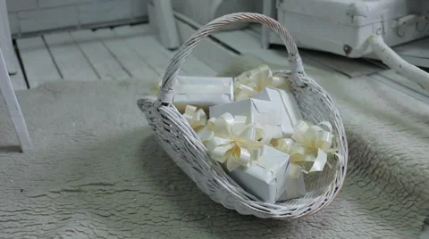 Decorated wicker white basket filled with christmas gifts, decor Stock Footage 45795216