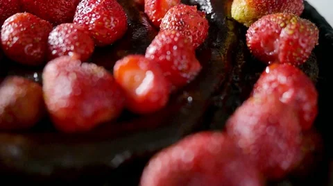 Decorating cake with chocolate spread and fresh strawberry in slowmotion Stock Footage 59139240