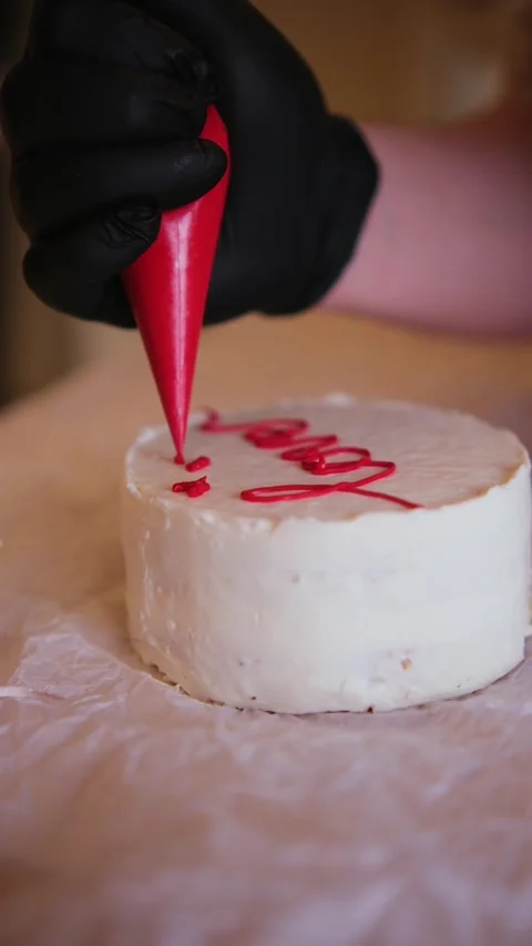 Decorating a cake with cream Stock Footage 309953980