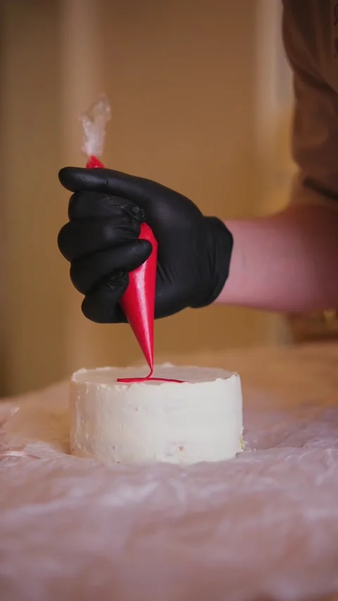 Decorating a cake with cream Stock Footage 309954000