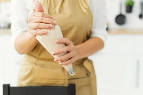 Decorating the cake with cream Stock Photos
