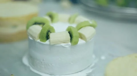 Decorating Cake With Fruits Stock Footage 61943675