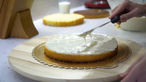 Decorating cake wth white cream, Stock Footage 120607606