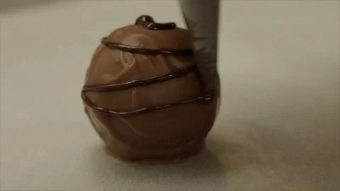 Decorating a Chocolate Praline Closeup Stock Footage 99164888