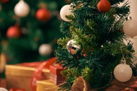 Decorating Christmas tree on bright background Stock Photos