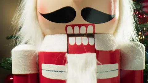 Decorating the Christmas Tree Featuring a Traditional Nutcracker Ornament 库存影片 331107238