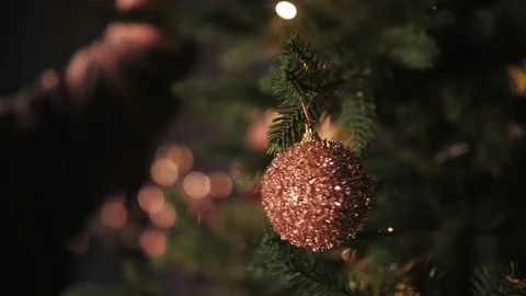 Decorating the Christmas tree with lights and toys Stock Footage 167154371