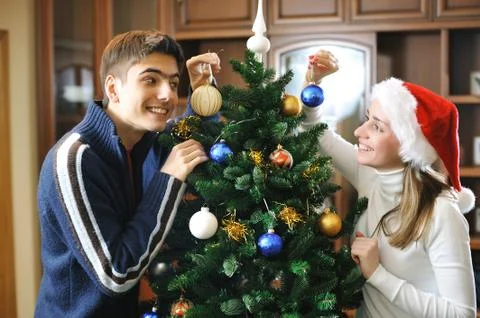 Decorating christmas tree Stock Photos