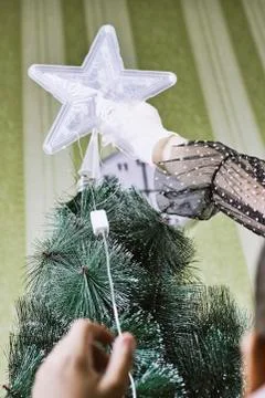 Decorating Christmas tree Stock Photos
