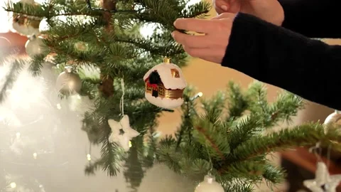Decorating a Christmas tree. Winter atmospheric festive video Stock Footage 286243023