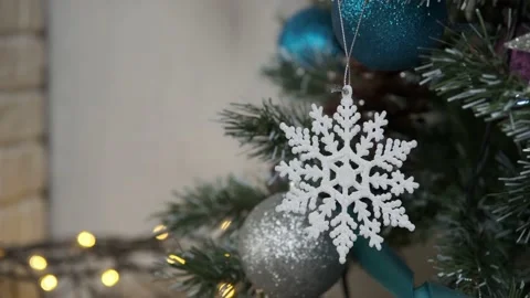Decorating Christmas tree withsnowflake on the background Stock Footage 168235651