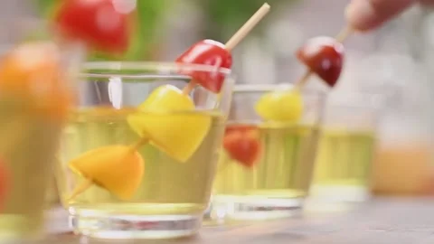 Decorating clear tomato soup, served in a glass. Stock Footage 159400078